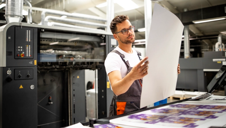 Man compiling print documents
